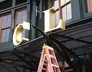 Installing Signage at Clyde's Restaurant