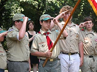 Boy Scouts lead Pledge of Allegiance at local 4th of July parade.