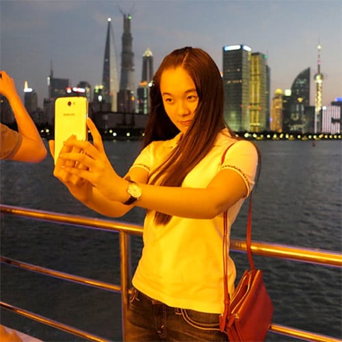 Woman taking selfie in Shanghai