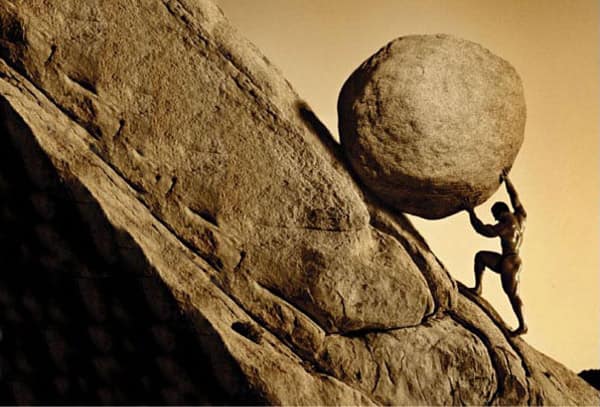 Sisyphus rolling bolder up a hill