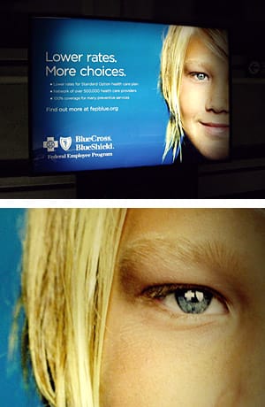 Top: Blue Cross backlighted ad, Bottom: Detail of the eye