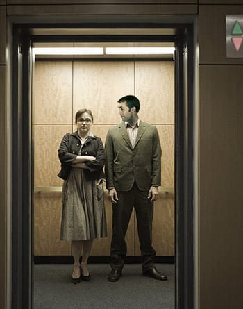 Two people in an elevator